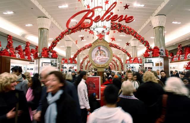 A crowd of shoppers hunt for bargains at Macy's in New York. Picture: Getty