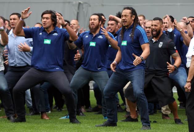 Former players including Tana Umaga (front R) perform a haka during the memorial service for New Zealand All Blacks rugby legend Jonah Lomu. Picture: AFP/Getty