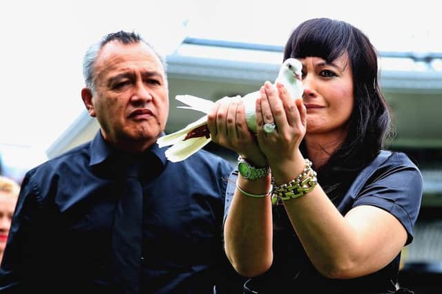 Widow of Jonah Lomu, Nadene (R), releases a dove at New Zealand's home of rugby, Eden Park. Picture: AFP/Getty