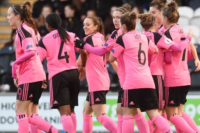 Scotland's Jane Ross (centre) celebrates after opening the scoring. Picture: SNS