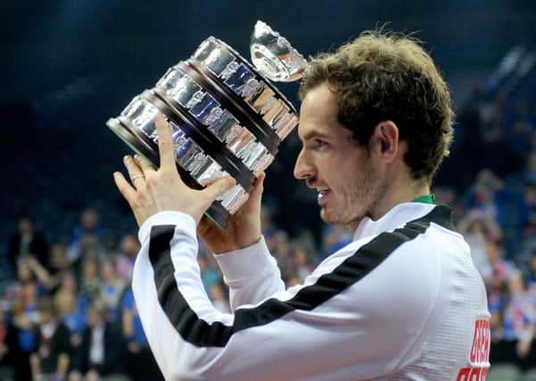 Andy Murray holds the Davis Cup aloft. Picture: Jane Barlow
