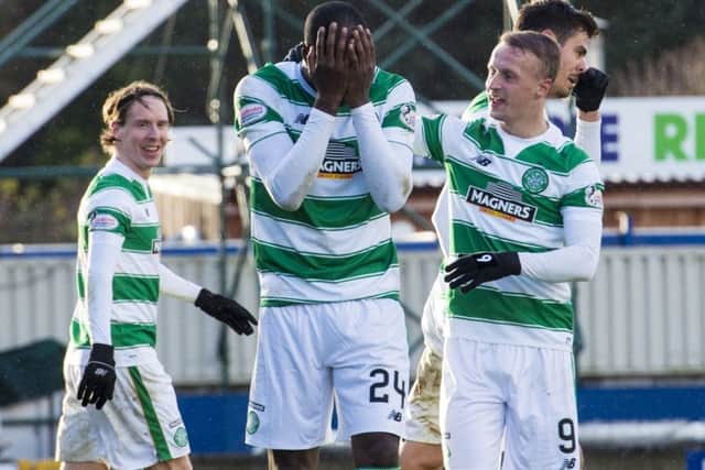 Celtic's Carlton Cole (left) "celebrates" with Leigh Griffiths having seen his effort deflected by Inverness CT's Danny Devine into the back of his own net. Picture: SNS