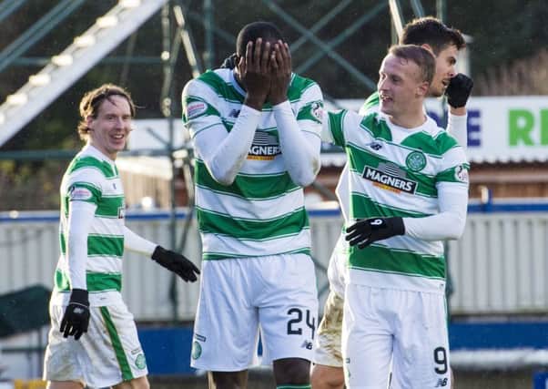 Celtic's Carlton Cole (left) "celebrates" with Leigh Griffiths having seen his effort deflected by Inverness CT's Danny Devine into the back of his own net. Picture: SNS