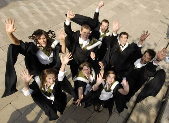 Students celebrate their graduation from the University of Edinburgh. Degrees allied to medicine and business remain the most popular among Scots. Picture: Phil Wilkinson