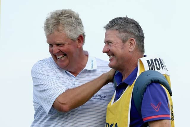 Colin Montgomerie and caddie Alastair McLean celebrate after winning the Senior PGA Championship.  Picture: Andy Lyons/Getty Images