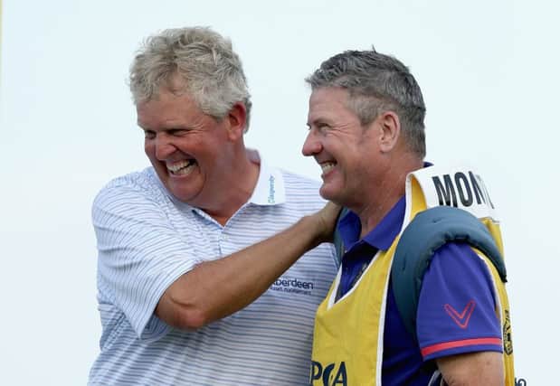 Colin Montgomerie and caddie Alastair McLean celebrate after winning the Senior PGA Championship.  Picture: Andy Lyons/Getty Images
