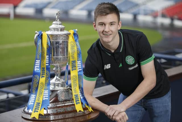 Celtic's Kieran Tierney poses with the Scottish Cup at the fourth round draw. Picture: Steve Welsh