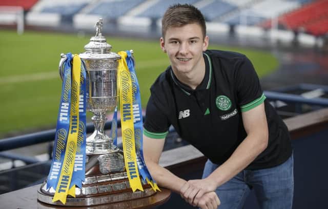 Celtic's Kieran Tierney poses with the Scottish Cup at the fourth round draw. Picture: Steve Welsh
