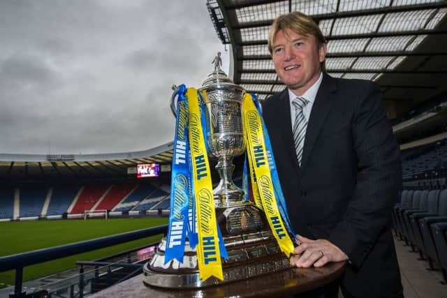 Current Scotland assistant national coach Stuart McCall helps to conduct the draw for the fourth round of the William Hill Scottish Cup. Picture: SNS