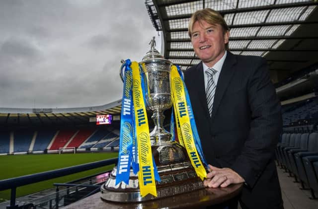 Current Scotland assistant national coach Stuart McCall helps to conduct the draw for the fourth round of the William Hill Scottish Cup. Picture: SNS