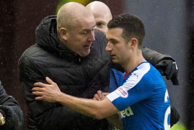 Warburton congratulates Jason Holt as the goalscorer is substituted in last night's victory over Dumbarton. Picture: SNS