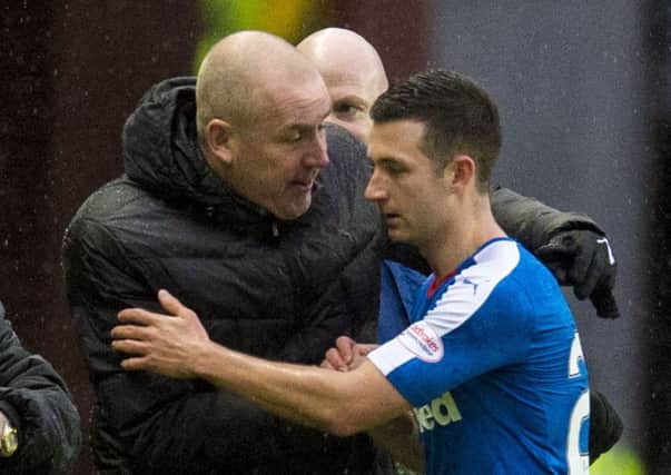 Warburton congratulates Jason Holt as the goalscorer is substituted in last night's victory over Dumbarton. Picture: SNS