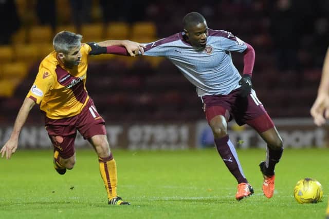 Hearts' Arnaud Djoum in action against Motherwell's Keith Lasley. Picture: SNS