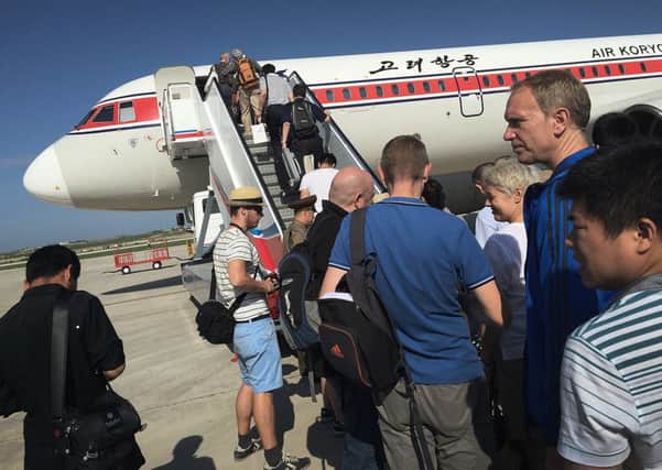 Passengers prepare to board a flight at Pyongyang Airport. Picture: AP