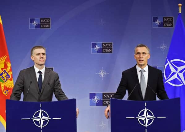 Montenegro's Deputy Prime minister Igor Luksic (left) and NATO Secretary General Jens Stoltenberg in Brussels. Picture: AFP/Getty Images