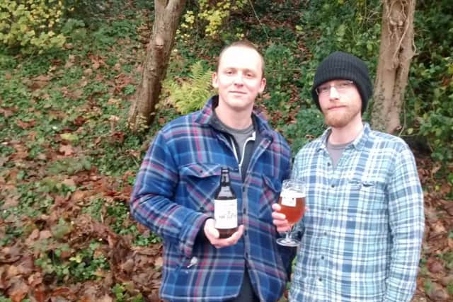 Simon Tardivel (right) of St Andrews Brewery Company is pictured  with a colleague and a glass of Hop Scotch