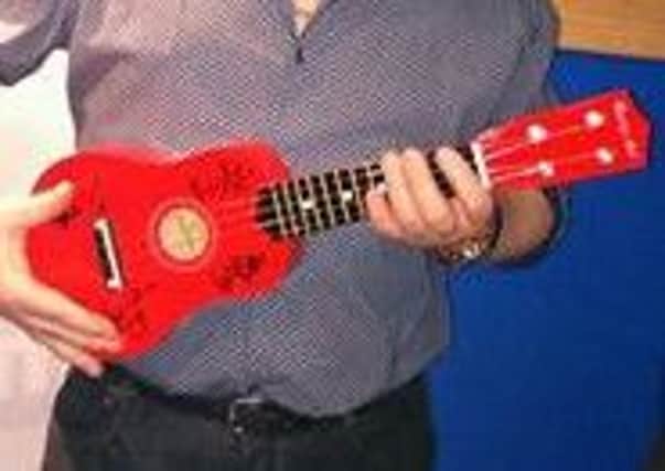 The signed ukelele up for auction today was donated by The View. Photo: Wave 102FM