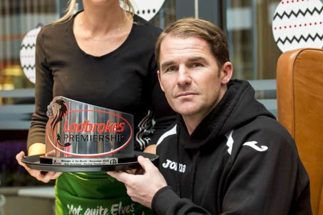 Alan Archibald receives his award. Picture: SNS