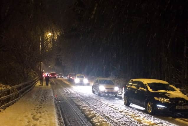 Heavy snow causes heavy traffic congestion last night around the Bush Estate, near Penicuik, Midlothian. Picture: HeMedia