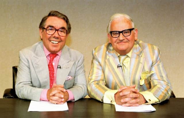 It's a good night from me... Ronnie Corbett and Ronnie Barket pictured together at their news desk. Picture: PA