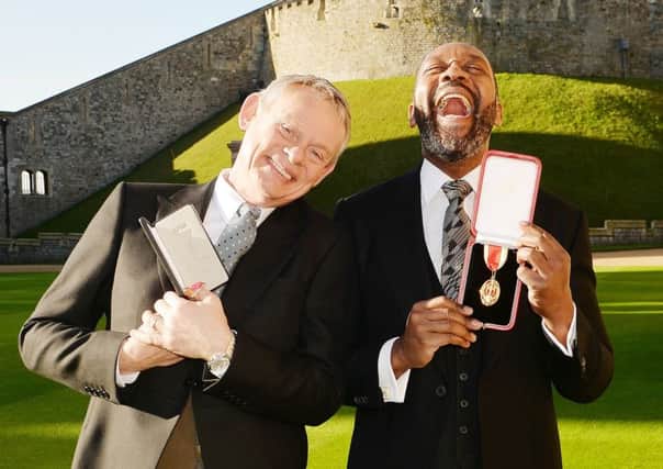 Lenny Henry with actor Martin Clunes  after receiving their awards. Picture: PA