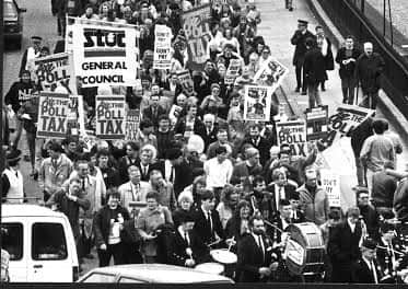 People marching in protest over the poll tax in Scotland.