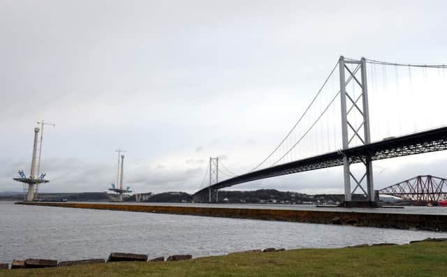 The Forth Road Bridge, right, which closed today for the rest of the month, and the start of construction for the Queensferry Crossing. Picture: Lisa Ferguson