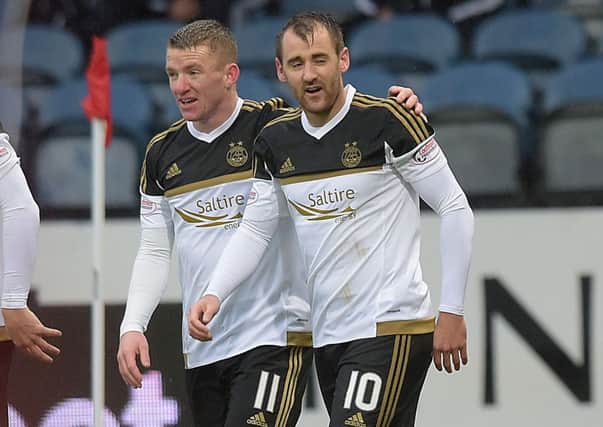Niall McGinn celebrates his goal with Aberdeen team-mate Jonny Hayes (left). Picture: SNS Group