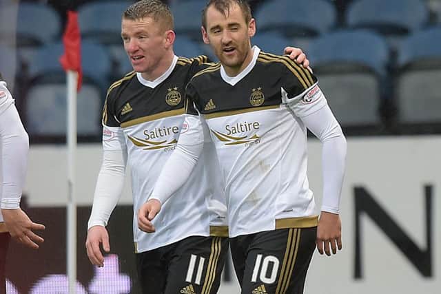 Niall McGinn celebrates his goal with Aberdeen team-mate Jonny Hayes (left). Picture: SNS Group