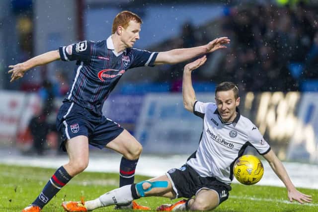 Ross County's Scott Boyd (left) battles for the ball against St Johnstone's Steven MacLean. Picture: SNS Group
