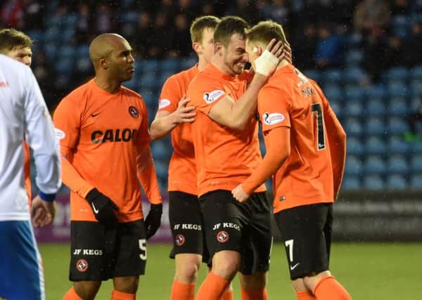 Billy McKay (right) is congratulated by team mate Gavin Gunning after scoring the equaliser for Dundee United. Picture: SNS Group
