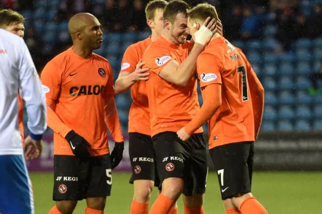 Billy McKay (right) is congratulated by team mate Gavin Gunning after scoring the equaliser for Dundee United. Picture: SNS Group