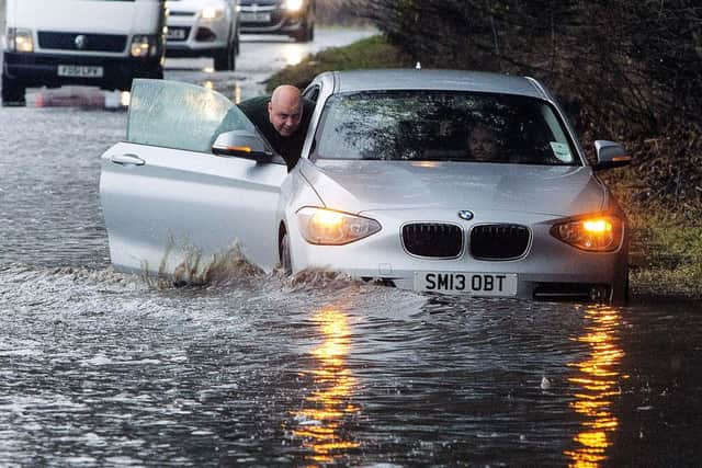 A car struggles through flood waters in Hawick in the Scottish Borders. Picture: Hemedia