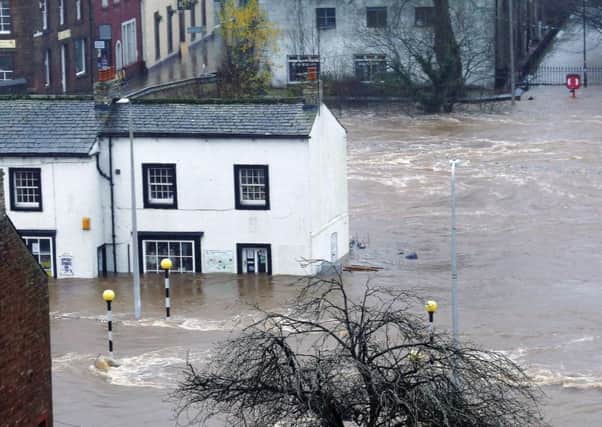 Flooded roads in Appleby in Cumbria as Storm Desmond hits the UK. Picture: PA