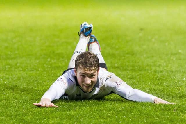 David Wotherspoon celebrates after his second goal put the visiting team 2-0 up and on their way to a seventh consecutive away win. Picture: SNS
