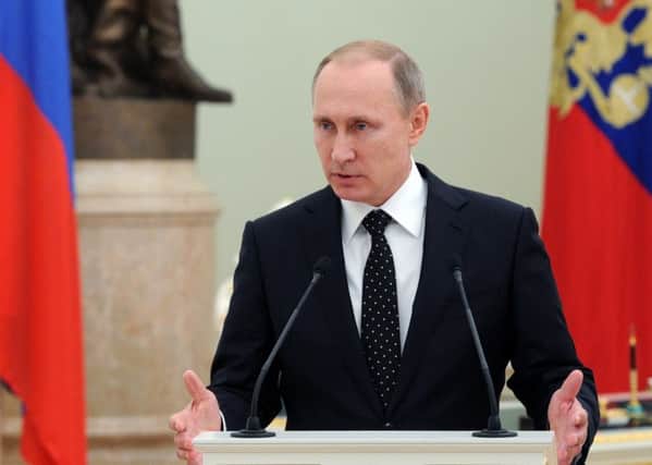 Vladimir Putin has transformed his image through his decision to bomb Islamic State targets in Syria. Picture: AP