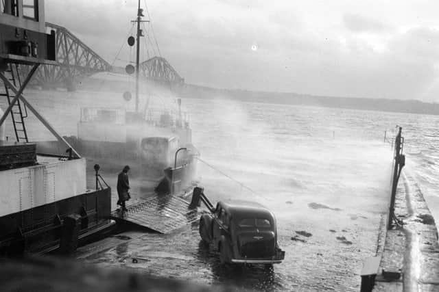A car boards the ferry at North Queensferry in stormy weather in January 1953. Picture: TSPL