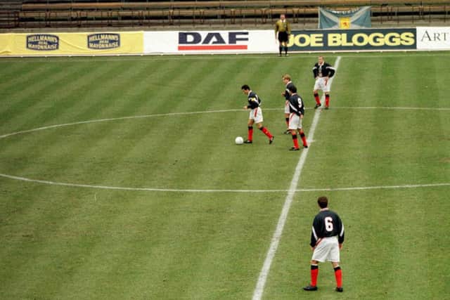 John Collins and Billy Dodds kick off in Talllinn, only for the match to be abandoned after just three seconds. Picture: AllSport