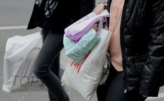 Black Friday and store offers were cited as pressures making people feel they had to spend more. Picture: Anthony Devlin/PA Wire