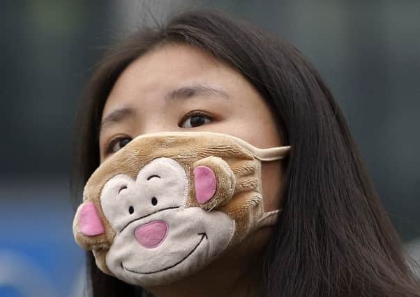 Those who ventured outside wore facemasks with filters. Picture: AP