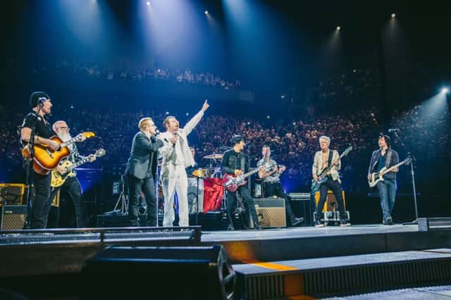 The Eagles Of Death Metal and U2 on stage in Paris. Picture: PA