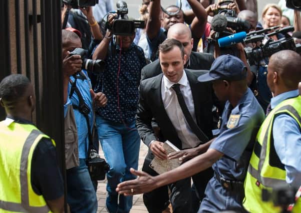 Oscar Pistorius was once again surrounded by media as he entered court in Pretoria yesterday for a hearing. Picture: AFP/Getty Images