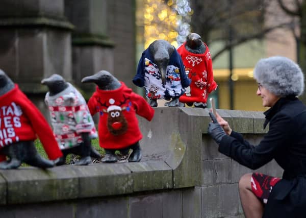 The Penguin statues in Dundee dressed in Christmas jumpers as part of Macmillan's Text Santa Christmas appeal.