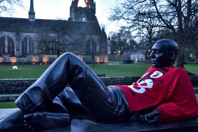 The Lounging Student statue outside King's College in Aberdeen, Scotland.