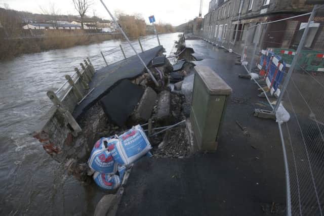 Damage caused to a roadway that was viewed by Scottish environment minister Aileen McLeod during her visit to the Borders town of Hawick. Picture: PA