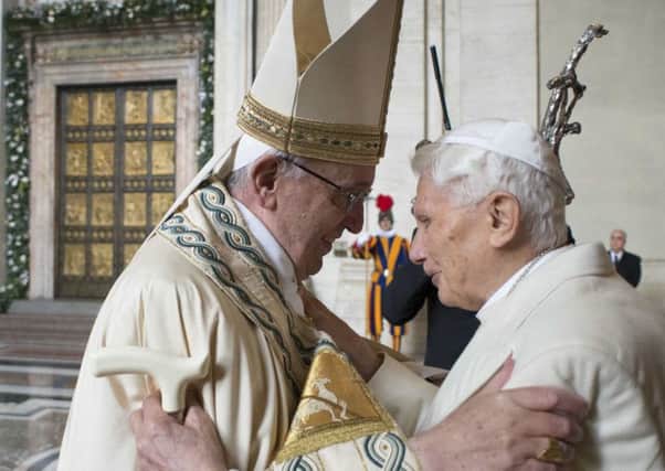 Pope Francis greets his predecessor, Benedict XVI. Picture: AP