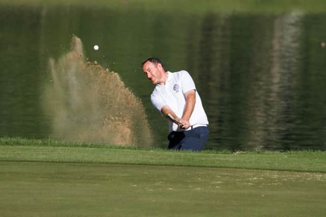 Clydeway Golf's Graham Fox splashes out of a bunker on his way to a three-under-par 69