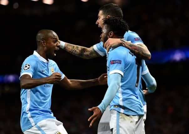 Raheem Sterling celebrates with team-mates after scoring his second goal.  Picture: Getty