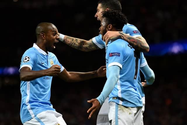 Raheem Sterling celebrates with team-mates after scoring his second goal.  Picture: Getty
