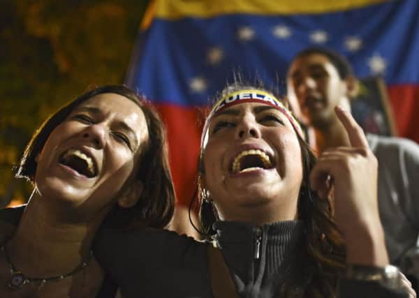 Venezuelan opposition supporters celebrate the results of the election in Caracas. Picture: AFP/Getty Images